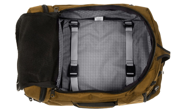An Techonaut 45 with a Coyote (curry brown) exterior with a Northwest Sky 200 Halcyon (grey with white grid) interior..